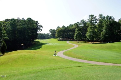 This exceptional property on a private wooded lot in the heart on Devils Ridge Golf Club in North Carolina - for sale on GolfHomes.com, golf home, golf lot