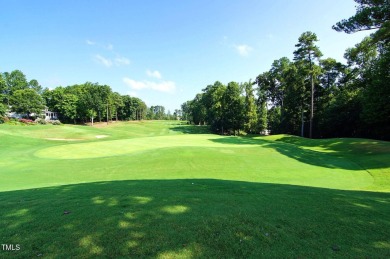 This exceptional property on a private wooded lot in the heart on Devils Ridge Golf Club in North Carolina - for sale on GolfHomes.com, golf home, golf lot