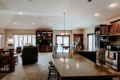 This beautifully maintained ranch home sits on over half an acre on The Ridge Golf Club in Iowa - for sale on GolfHomes.com, golf home, golf lot