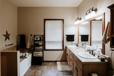 This beautifully maintained ranch home sits on over half an acre on The Ridge Golf Club in Iowa - for sale on GolfHomes.com, golf home, golf lot