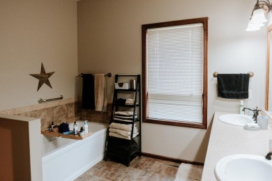This beautifully maintained ranch home sits on over half an acre on The Ridge Golf Club in Iowa - for sale on GolfHomes.com, golf home, golf lot