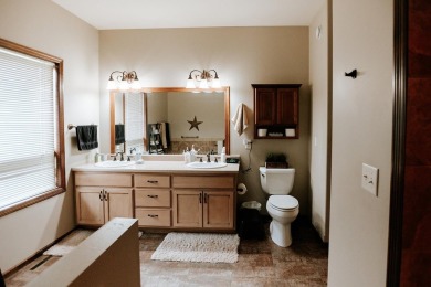 This beautifully maintained ranch home sits on over half an acre on The Ridge Golf Club in Iowa - for sale on GolfHomes.com, golf home, golf lot