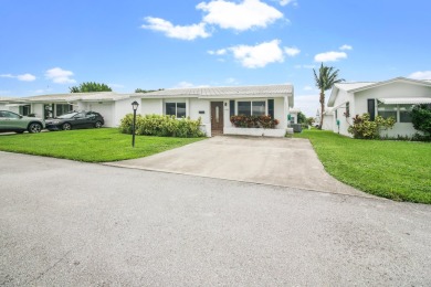 Welcome to this 2-bed, 2-bath home in the 55+ Palm Beach on Leisureville Community Golf Course in Florida - for sale on GolfHomes.com, golf home, golf lot