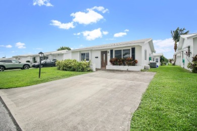 Welcome to this 2-bed, 2-bath home in the 55+ Palm Beach on Leisureville Community Golf Course in Florida - for sale on GolfHomes.com, golf home, golf lot