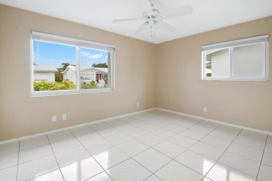 Welcome to this 2-bed, 2-bath home in the 55+ Palm Beach on Leisureville Community Golf Course in Florida - for sale on GolfHomes.com, golf home, golf lot