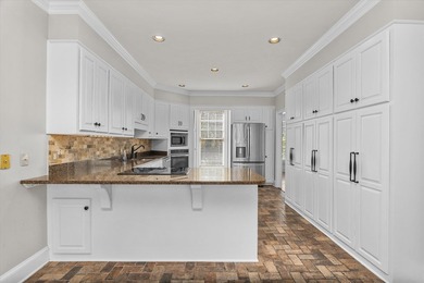 Welcome to 3684 Inverness Way, a stunning all-brick home located on West Lake Country Club in Georgia - for sale on GolfHomes.com, golf home, golf lot