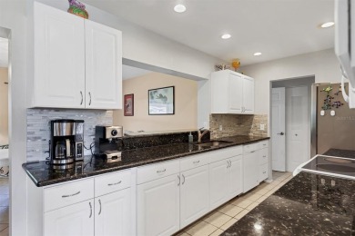 Flamingo house. Charming Floridian home, meticulously maintained on Jacaranda West Country Club in Florida - for sale on GolfHomes.com, golf home, golf lot