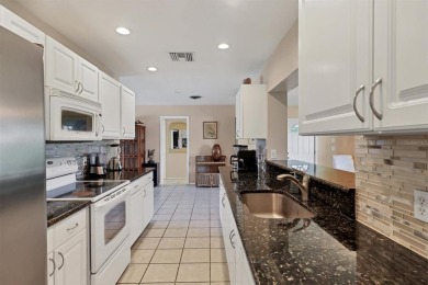 Flamingo house. Charming Floridian home, meticulously maintained on Jacaranda West Country Club in Florida - for sale on GolfHomes.com, golf home, golf lot