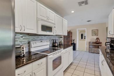 Flamingo house. Charming Floridian home, meticulously maintained on Jacaranda West Country Club in Florida - for sale on GolfHomes.com, golf home, golf lot