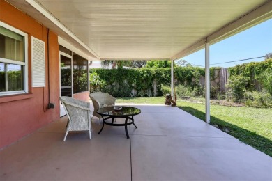 Flamingo house. Charming Floridian home, meticulously maintained on Jacaranda West Country Club in Florida - for sale on GolfHomes.com, golf home, golf lot