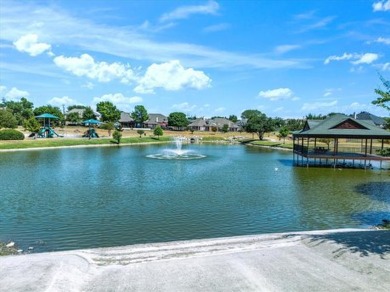 This spacious family home offers the perfect blend of comfort on Eagle Mountain Country Club  in Texas - for sale on GolfHomes.com, golf home, golf lot