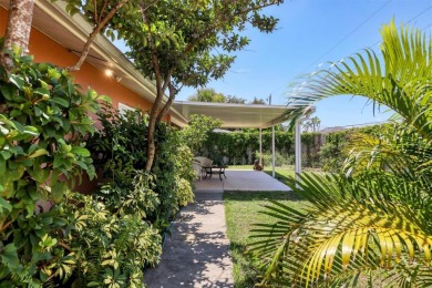 Flamingo house. Charming Floridian home, meticulously maintained on Jacaranda West Country Club in Florida - for sale on GolfHomes.com, golf home, golf lot