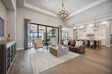 Step into a turnkey dream nestled in a prestigious GOLF on Ritz-Carlton Members Golf Club in Florida - for sale on GolfHomes.com, golf home, golf lot