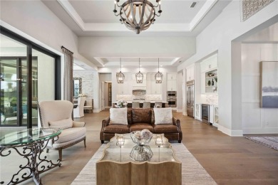 Step into a turnkey dream nestled in a prestigious GOLF on Ritz-Carlton Members Golf Club in Florida - for sale on GolfHomes.com, golf home, golf lot