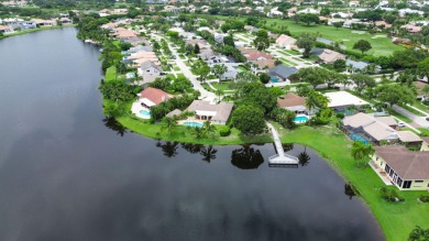 Tucked away on a quiet cul-de-sac and backing onto the lush on The Boca Country Club in Florida - for sale on GolfHomes.com, golf home, golf lot