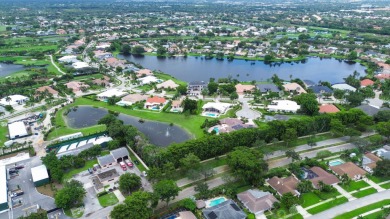 Tucked away on a quiet cul-de-sac and backing onto the lush on The Boca Country Club in Florida - for sale on GolfHomes.com, golf home, golf lot