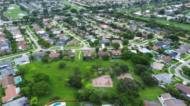 Tucked away on a quiet cul-de-sac and backing onto the lush on The Boca Country Club in Florida - for sale on GolfHomes.com, golf home, golf lot