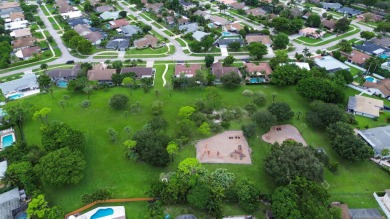 Tucked away on a quiet cul-de-sac and backing onto the lush on The Boca Country Club in Florida - for sale on GolfHomes.com, golf home, golf lot