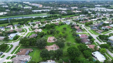 Tucked away on a quiet cul-de-sac and backing onto the lush on The Boca Country Club in Florida - for sale on GolfHomes.com, golf home, golf lot