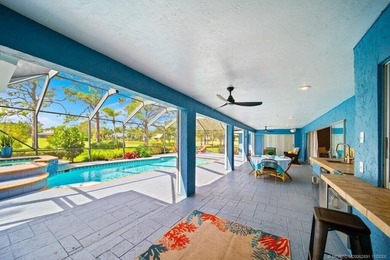 This 4BR/3BA CBS pool home sits on a private 1-acre cul-de-sac on Evergreen Club in Florida - for sale on GolfHomes.com, golf home, golf lot