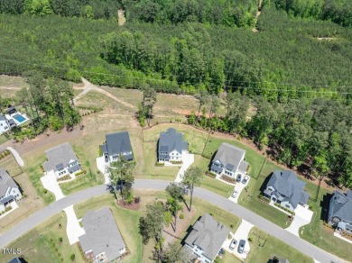 Nestled in the prestigious and sought-after Hasentree, lies the on Hasentree Club in North Carolina - for sale on GolfHomes.com, golf home, golf lot