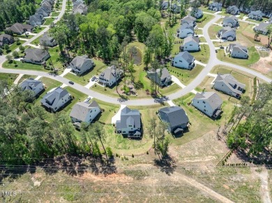 Nestled in the prestigious and sought-after Hasentree, lies the on Hasentree Club in North Carolina - for sale on GolfHomes.com, golf home, golf lot