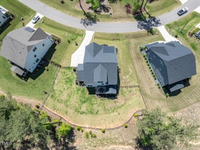 Nestled in the prestigious and sought-after Hasentree, lies the on Hasentree Club in North Carolina - for sale on GolfHomes.com, golf home, golf lot