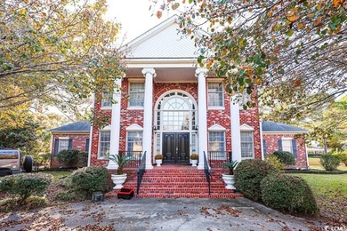 Experience luxury living in this exceptional custom-built brick on Myrtlewood Golf Course and Club  in South Carolina - for sale on GolfHomes.com, golf home, golf lot