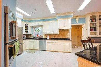 Experience luxury living in this exceptional custom-built brick on Myrtlewood Golf Course and Club  in South Carolina - for sale on GolfHomes.com, golf home, golf lot