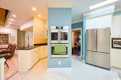 Experience luxury living in this exceptional custom-built brick on Myrtlewood Golf Course and Club  in South Carolina - for sale on GolfHomes.com, golf home, golf lot