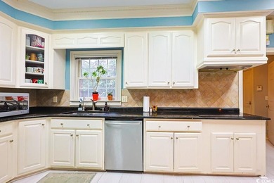 Experience luxury living in this exceptional custom-built brick on Myrtlewood Golf Course and Club  in South Carolina - for sale on GolfHomes.com, golf home, golf lot