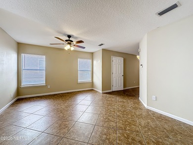 Location, lifestyle, and space come together in this spacious on Golf Club At Fleming Island in Florida - for sale on GolfHomes.com, golf home, golf lot