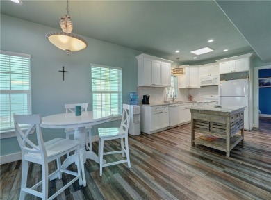 Come and enjoy this fun, colorful beach house in Mustang Royale on Palmilla Beach Golf Club in Texas - for sale on GolfHomes.com, golf home, golf lot