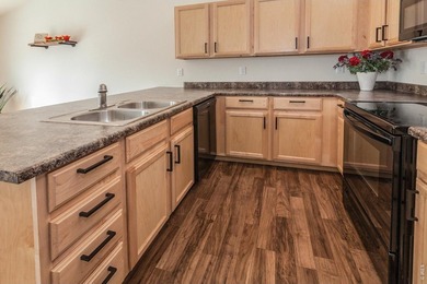 Situated on a desirable corner lot, this home offers added on Raindance National Golf Course in Colorado - for sale on GolfHomes.com, golf home, golf lot