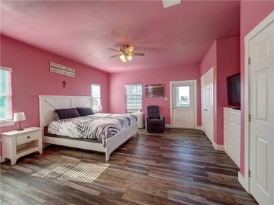Come and enjoy this fun, colorful beach house in Mustang Royale on Palmilla Beach Golf Club in Texas - for sale on GolfHomes.com, golf home, golf lot
