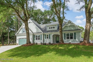 This brand new Riptide home with stunning setting and finishes on Sea Trail Golf Resort in North Carolina - for sale on GolfHomes.com, golf home, golf lot