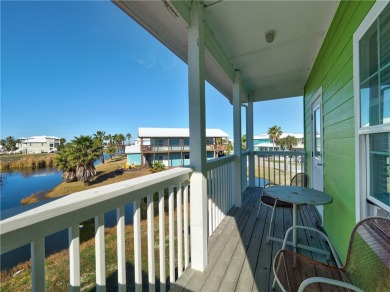 Come and enjoy this fun, colorful beach house in Mustang Royale on Palmilla Beach Golf Club in Texas - for sale on GolfHomes.com, golf home, golf lot