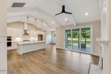 This brand new Riptide home with stunning setting and finishes on Sea Trail Golf Resort in North Carolina - for sale on GolfHomes.com, golf home, golf lot