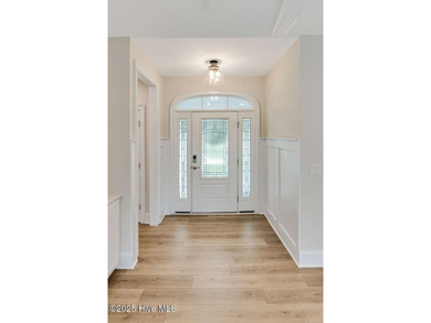 This brand new Riptide home with stunning setting and finishes on Sea Trail Golf Resort in North Carolina - for sale on GolfHomes.com, golf home, golf lot