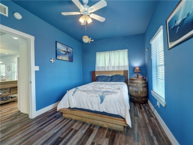 Come and enjoy this fun, colorful beach house in Mustang Royale on Palmilla Beach Golf Club in Texas - for sale on GolfHomes.com, golf home, golf lot