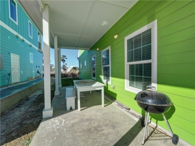 Come and enjoy this fun, colorful beach house in Mustang Royale on Palmilla Beach Golf Club in Texas - for sale on GolfHomes.com, golf home, golf lot