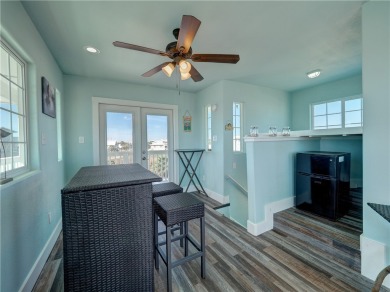 Come and enjoy this fun, colorful beach house in Mustang Royale on Palmilla Beach Golf Club in Texas - for sale on GolfHomes.com, golf home, golf lot