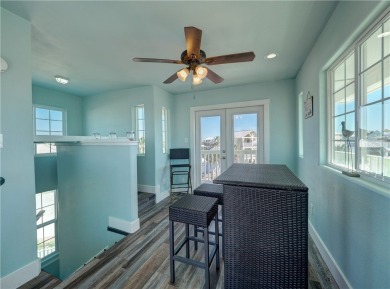 Come and enjoy this fun, colorful beach house in Mustang Royale on Palmilla Beach Golf Club in Texas - for sale on GolfHomes.com, golf home, golf lot