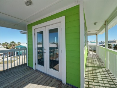 Come and enjoy this fun, colorful beach house in Mustang Royale on Palmilla Beach Golf Club in Texas - for sale on GolfHomes.com, golf home, golf lot