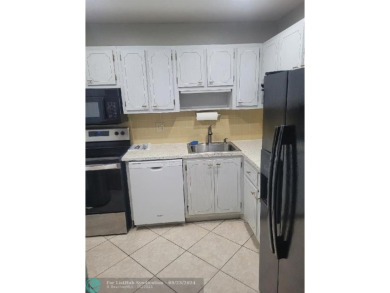 SPACIOUS 2 BEDROOM 2 BATHROOM CONDO UNIT WITH BEAUTIFUL GOLF on Oriole Golf and Tennis Club in Florida - for sale on GolfHomes.com, golf home, golf lot