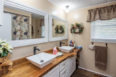 This well cared for ranch style home at Lost Lake Woods Club on Lost Lake Woods Club in Michigan - for sale on GolfHomes.com, golf home, golf lot