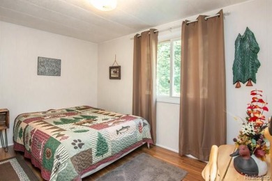This well cared for ranch style home at Lost Lake Woods Club on Lost Lake Woods Club in Michigan - for sale on GolfHomes.com, golf home, golf lot