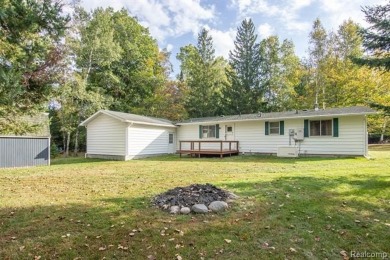This well cared for ranch style home at Lost Lake Woods Club on Lost Lake Woods Club in Michigan - for sale on GolfHomes.com, golf home, golf lot