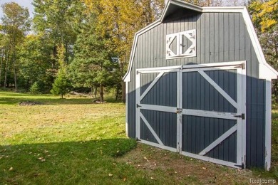 This well cared for ranch style home at Lost Lake Woods Club on Lost Lake Woods Club in Michigan - for sale on GolfHomes.com, golf home, golf lot