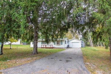 This well cared for ranch style home at Lost Lake Woods Club on Lost Lake Woods Club in Michigan - for sale on GolfHomes.com, golf home, golf lot